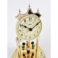 23cm Gold Anniversary Clock With Black Forest Figurines & Cream Dial By HALLER image